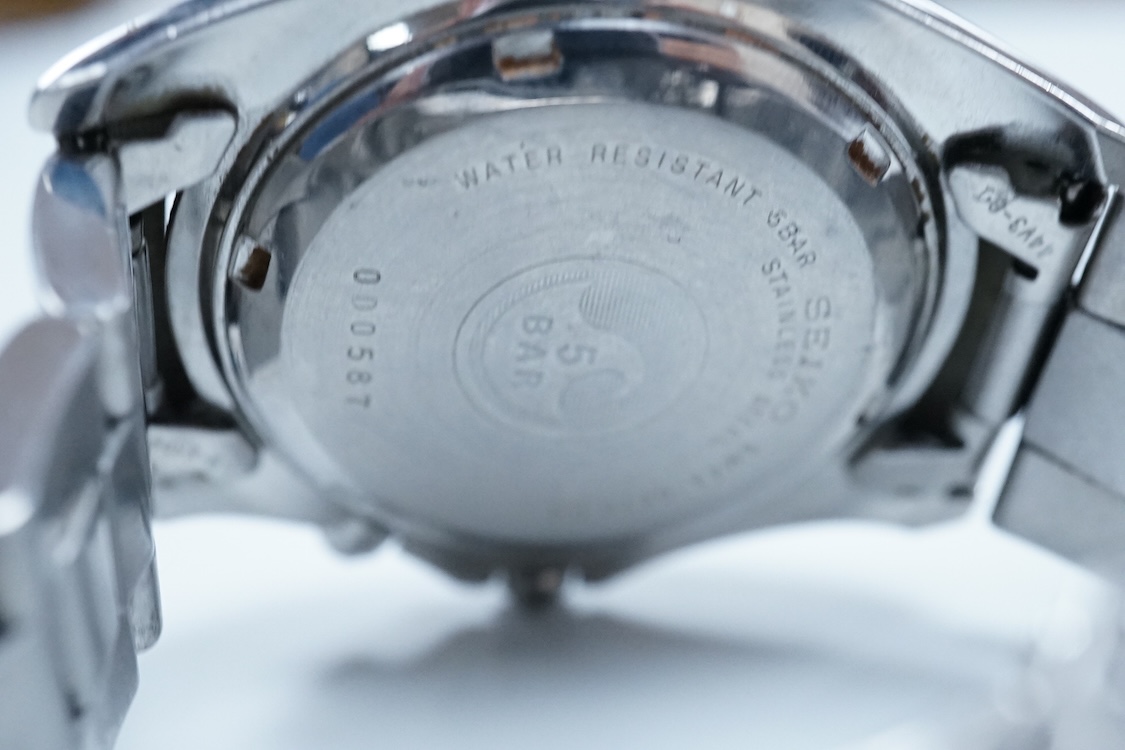 A gentleman's 1970's stainless steel Omega Dynamic manual wind wrist watch, with blue dial and baton numerals, case diameter 40mm, on a leather strap wit Omega buckle, together with a gentleman's Seiko Kinetic and a simi